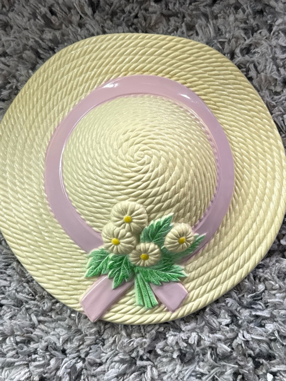 Cream Decorative Straw Wall Hat with Pink Trim and Green Floral Accent